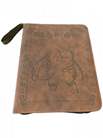 Front cover of the Pokemon card binder showing brown faux leather with embossed Charizard and decorative symbols