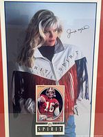 Front view of the framed Spirit poster featuring a woman in a fringe jacket and a signature by Jennifer Montana.