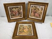 Three square vintage French Baroque tapestries in matching gold-painted frames arranged on a white surface.