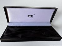 Open Montblanc fountain pen case showing the white interior lining with Montblanc logo and black cushioned base.