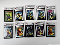 Group shot of ten graded and one loose sleeve card, laid out in two rows