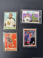 Four vintage hockey cards shown together on black background