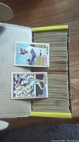 Open cardboard box filled tightly with approximately 250+ vintage baseball cards from 1978 O-Pee-Chee set, featuring some action and portrait shots on top.