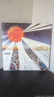 Front cover of California Jam 2 double vinyl album showing an outdoor concert scene with audience and stage lights