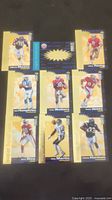 Full view of all nine Upper Deck football cards laid out with yellow 'super bowl bound' background showing players mostly from 49ers and Chargers.