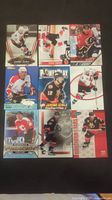 Photo of nine Jerome Iginla hockey cards laid out in three rows, each card showing player in Calgary Flames uniform from various manufacturers.