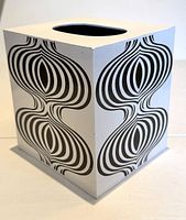 Photo of the cube tissue box holder showing groovy black and white optical pattern on side.