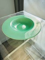 Top view showing the translucent green jadeite bowl with a bubble inside the glass.