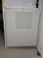 Photo of white or cream vertical blind panel showing width and length