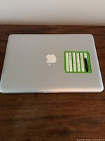 Closed laptop top exterior with inventory tag on lid