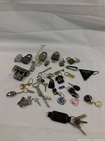 Full spread of vintage keychains and assorted locks showing size, shape, and style variety