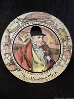Front view of the Royal Doulton "The Hunting Man" porcelain plate, showing the detailed multicolor painted image of a man in hunting attire with hunting accessories around the border.