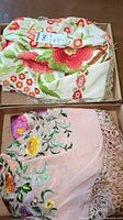 Both linens folded in a box showing overall lot