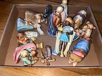 Multiple Goebel porcelain nativity figurines in cardboard box