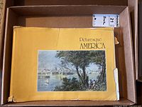 Image of the cover with title 'Picturesque America' showing wear and tear on edges and corners.