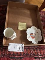 Box containing two items: a commemorative mug and a leaf-shaped dish with King Edward portrait