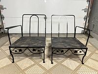 Two-piece vintage loveseat set with black metal frames and wooden seats, showing overall front view.
