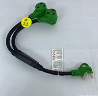 Full view of the heavy-duty power splitter cord showing single plug end and two outlet ends with a yellow sticker.