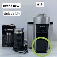 Front view of Nespresso Vertuo coffee machine with Aeroccino 3 frother and its box, showing brand new condition and power cords.