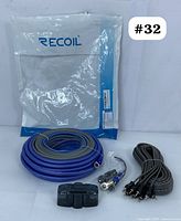 Recoil RCK44 wiring kit cables and components grouped with original packaging behind.