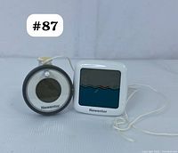 Floating sensor and digital display screen side by side showing the Newentor brand clearly.