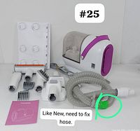 Full kit of Homeika pet grooming vacuum with multiple attachments spread out, hose repair circled in green tape.