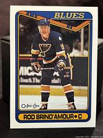 Front side of the 1990-91 OPC Rod Brind'Amour rookie card showing the player in St. Louis Blues uniform on ice.