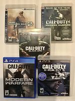 Front covers of all five Call of Duty game cases