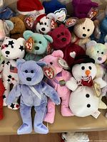 Close-up of front group of TY bears, snowman and others with tags visible
