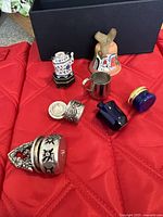 Group shot showing seven miniatures on red surface