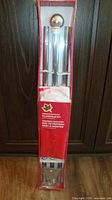 Front of sealed Canadian Flag Flagpole Kit showing pole sections and finial