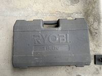Closed grey Ryobi 18.0V carrying case
