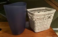 purple plastic bin beside white wicker basket