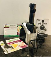 Yonanas machine assembled with manuals and recipe guide