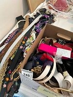 Photo showing a variety of ladies belts including woven, braided, and fabric belts in multiple colors and styles.