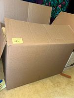 Closed large cardboard box marked with number 25