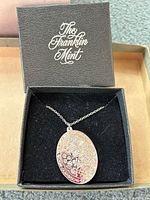 Sterling silver oval pendant necklace in original Franklin Mint black presentation box.