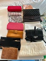 Image shows a collection of 12 vintage clutch purses including leather, fabric, beaded and satin materials in various colors and patterns.