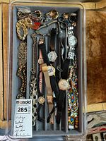 Full tray of watches and jewelry