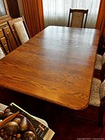 Top view of oak dining table showing grain and single leaf in place