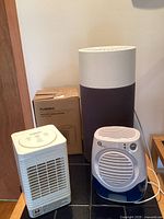 Lot showing Blueair air purifier, 1byone humidifier, and boxed Turbro fan heater