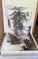 Japanese landscape ink scroll with mountainous scene and mist showing traditional brushwork style