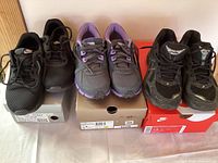 Three pairs of running shoes displayed front and top view, showing their design and color.