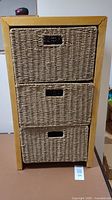 Front view showing three rattan wicker drawers in pine frame