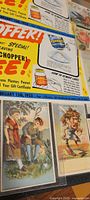 Close up of colorful Planters Nut Choppers promotional flyer alongside illustrated vintage cards showing people in vintage apparel.