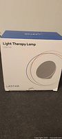 Box for Lastar Light Therapy Lamp CM01181 showing product branding and model number.