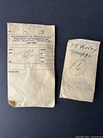 Two original paper envelopes containing vintage Swiss watch parts including a Patek stem and multiple mainsprings with handwritten labels.