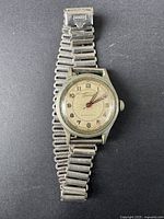 Full view of vintage Hoverist Swiss military men's watch on metal band.