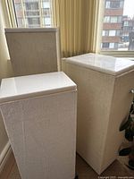 Three plinths grouped together showing overall size differences and matching finish