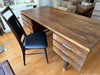 Front-left perspective of desk with chair